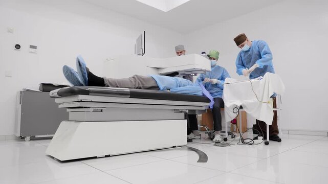 Patient receiving eye surgery from medical team in operating room, performing ophthalmology procedure for improved vision