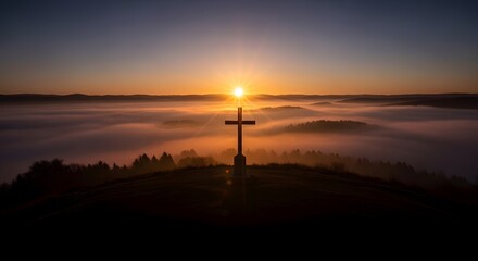 Easter sunday morning sunrise with cross on hilltop landscape