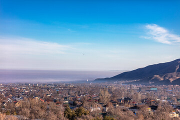 Obraz premium Landscape, mountain, trees, snow, city, winter, river, stream.
