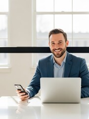 Fototapeta premium Smiling businessman sitting at a desk with laptop and phone in office