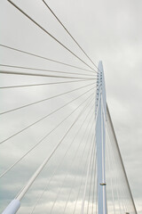 Fototapeta premium Architecture detail of Prins Clausbrug,cable-stayed bridge , low angle view on a cloudy sky. Utrecht,The Netherlands 