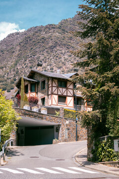 Residential street of Andorra la Vella with Pyrenees mountain in the background on a sunny day