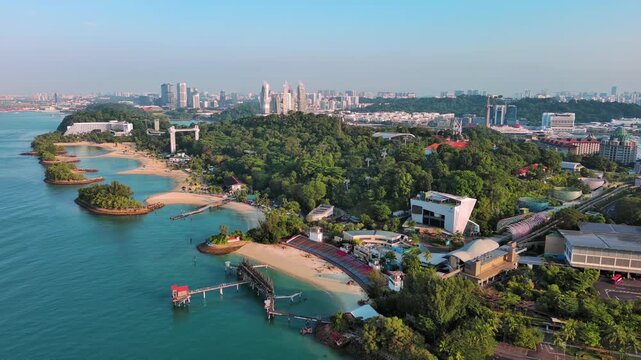 Sentosa Island, Singapore: Aerial view of Palawan Beach on famous island resort, tropical white sand, lush greenery - landscape panorama of Southeast Asia from above
