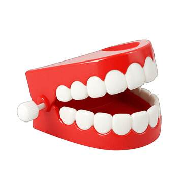 Classic Wind-Up Chattering Teeth Toy with Bright Red Gums and White Teeth, a Humorous Novelty Item, Isolated on Transparent Background for Easy Integration