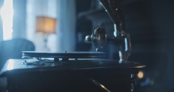 Needle on spinning disc of gramophone in spooky living room with lightning flashing - closeup