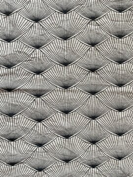 Japanese traditional seigaiha wave pattern on grey cotton fabric, overlapping fan-shaped scallop design