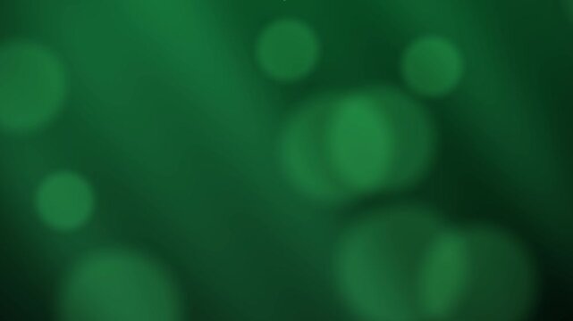 Abstract dark green bokeh background with floating blurred lights