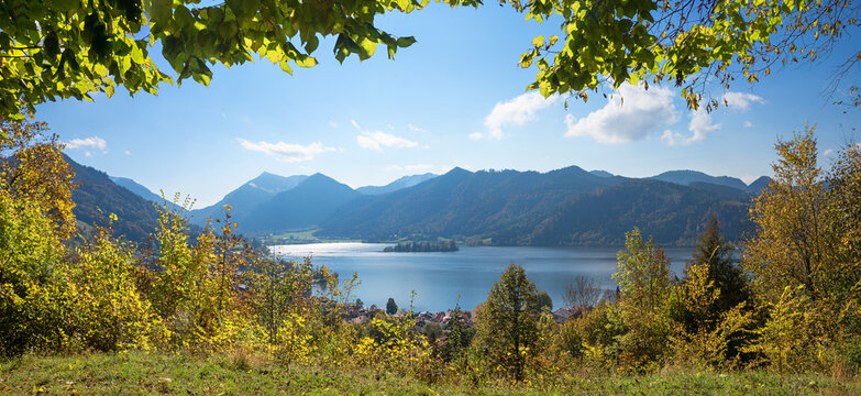 viewpoint Haiderdenkmal, hiking destination Schliersee, framed by green leaves, bavarian alps