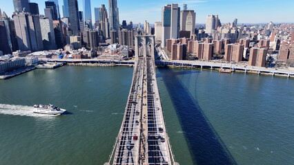 Obraz premium Brooklyn Bridge In Manhattan New York United States. Birds Eye View Of Suspension Bridge With Cars Driving Across. Business Sky Downtown Cityscape. Business Downtown Panorama. Manhattan New York.