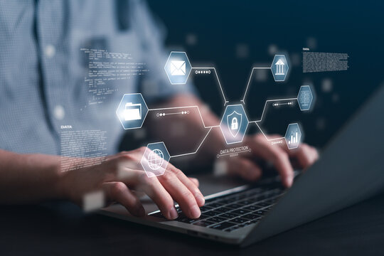 Close up of man typing on laptop keyboard with virtual data protection shield and encryption icons. Concept of cybersecurity software, secure cloud storage, and privacy coding.