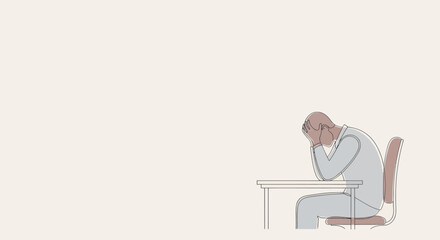 Man Sitting at Desk with Head Down.