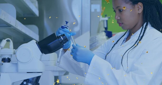 Female lab tech picking up pipette, aspirating sample for microscopy with gold stars overlaying