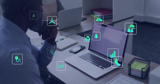 Analyst watching laptop as dashboard loading, icons clustering around desk, visualizing energy data