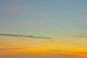 Obraz premium Wonderful New Zealand evening sky replacement of very soft thin clouds on a blue sky. Horizon a warm yellow and orange color to it.