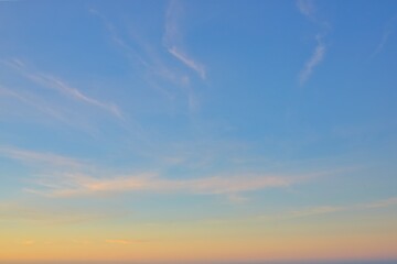 Obraz premium Wonderful New Zealand evening sky replacement of very soft thin clouds on a blue sky. Horizon a warm yellow color to it.