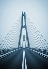 Obraz premium Modern Cable Stayed Bridge with Two Towers and Roadway in Overcast