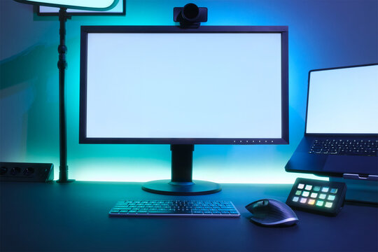 Creative Tech Desk Setup With Monitor Laptop Keyboard Mouse And Neon Backlighting For Studio Streaming