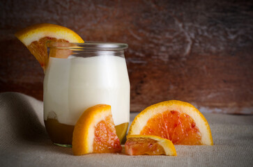 Blood Oranges with Plain Yogourt in a Glass Jar witn Rustic Tablecloth