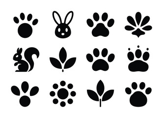 Fototapeta premium Collection of vector of icons of animals, paw prints, and leaves