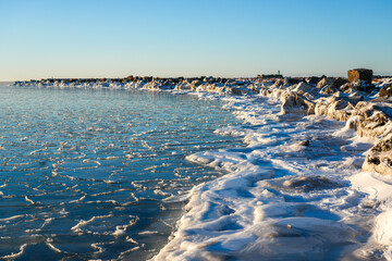 Winter Baltic Sea at Liepaja Harbor Gate Breakwater with Frozen Shoreline, Latvia Coast © Zigmunds