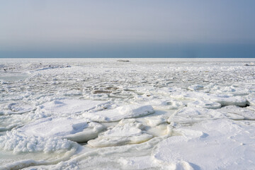 Vast Frozen Baltic Sea Coast Covered with Drift Ice and Snow in Winter © Zigmunds