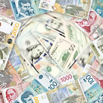 Serbian dinar banknotes and American dollars in blurred motion