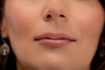 Fototapeta premium Highlight lustrous lips and luminous skin, Emphasize shiny lips and glowing skin tone, Draw attention to shimmering lips coupled with flawless and luminous skin appearance