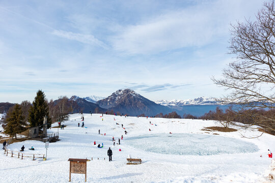 People playing in the snow in the Pertus area in Lombardy