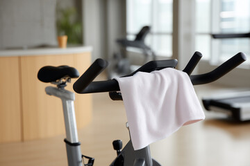 Empty indoor cycling bike waiting for a fitness enthusiast's return