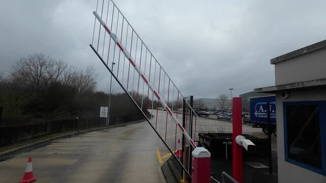 Security barrier lifting at industrial entrance 4K
