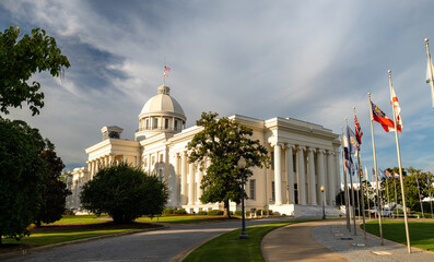 Scenic exterior view of the historic white dome and classical architecture of the Alabama State Capitol building in Montgomery, Alabama, United States.