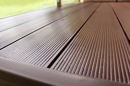 Outdoor plastic composite brown floor. Renovation terrace