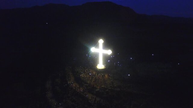 Aerial drone arc shot of the giant illuminated cross during the Meskel festival in Adigrat, Tigray, Ethiopia.
