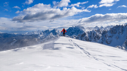 Beautiful Winter Mountain Scenery with Man on Cross-Country Skis , Aerial View