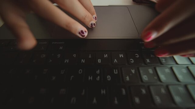 Nighttime work with swift keystrokes and decorated fingernails