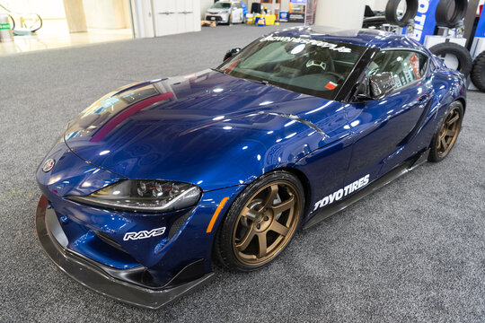 New York City, USA - March 28, 2024: Auto Show 2024. Toyota GR Supra sportscar. Toyota GR Supra fast sport coupe metallic blue color. Toyota GR Supra, corner view