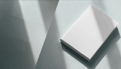 Mockup Blank White Book Lying on Textured Surface with Sunlight Shadows transparent