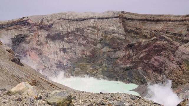Mount Aso Nakadake volcano crater, Aso-San, caldera, Aso-Kuju National Park hiking, Kyushu island region, Kumamoto prefecture, Japan, eruption with steam and smoke, volcanic desert landscape view