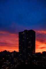 Sunset view over city skyline with buildings and colorful sky