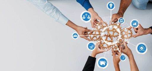 A vibrant image showcasing diverse hands grasping interconnected gears, representing teamwork and...