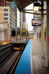Obraz premium View of Chicago Subway with Buildings flanking the tracks at Sunrise