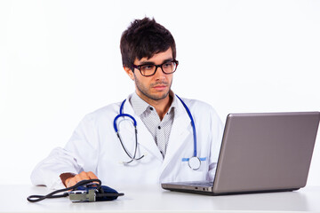 frendly young doctor working with his laptop