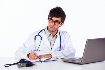 frendly young doctor working with his laptop