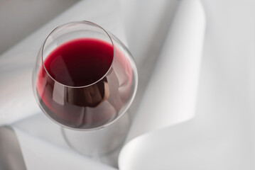 Red Wine Glass on Minimal Gray Background. Elegant Modern Beverage Concept