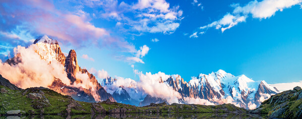 Mont Blanc, the highest peak in the Alps, rises dramatically above the alpine landscape on the...