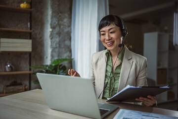 Asian woman remote working from home office