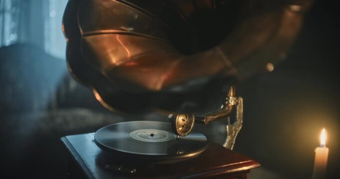 Rack focus from sound horn to turntable of gramophone in old, spooky house
