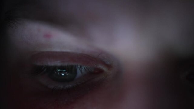 Receiving dopamine from endless reels the eye reflects bright moving clips showing the addictive pull of short form content and the constant chase for quick stimulation