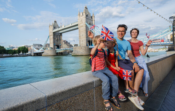 Happy tourist family enjoy visit Tower Bridge, centre London, UK