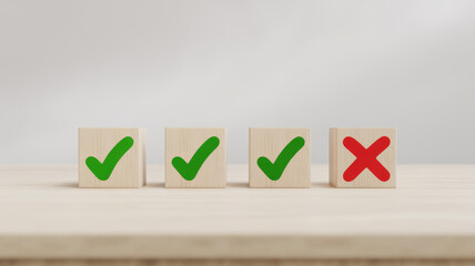 Wooden blocks with green checkmarks and red X for decision making